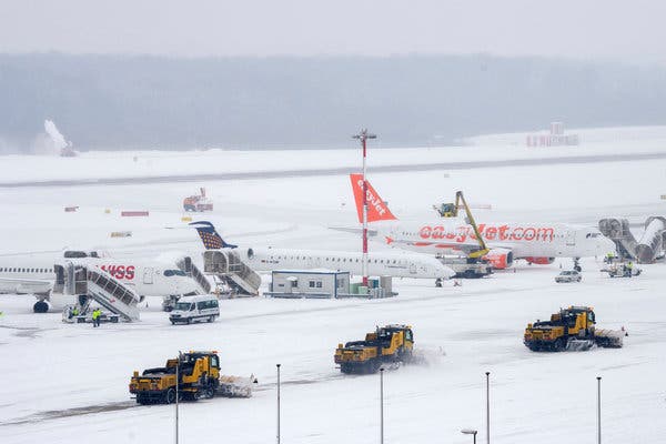 Makes travel tumult, Uncommon snowtorm closes Madrid air terminal